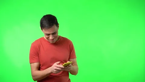 Cheerful guy receiving message on smartphone and smiling happily Stock Footage 172004845