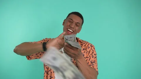 Cheerful guy throwing banknotes after winning bets Video stock 197082585