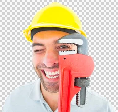 Cheerful handyman looking through monkey wrench Stock Photos