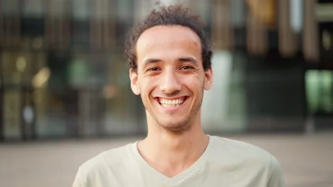 Cheerful Hispanic man laughing at camera Stock Footage 158071003