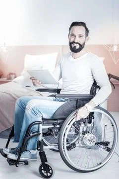 Cheerful invalid man posing on camera Foto stock
