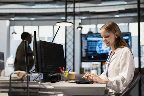 Cheerful junior dev writing code, developing machine learning APIs Stock Photos