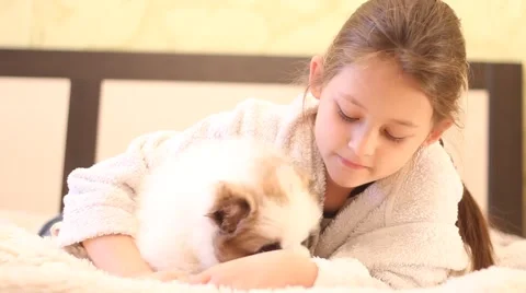 Cheerful kid playing with a puppy Stock Footage 44758872