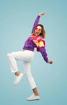 Cheerful lady shouting happily while celebrating success against blue background Stock Photos