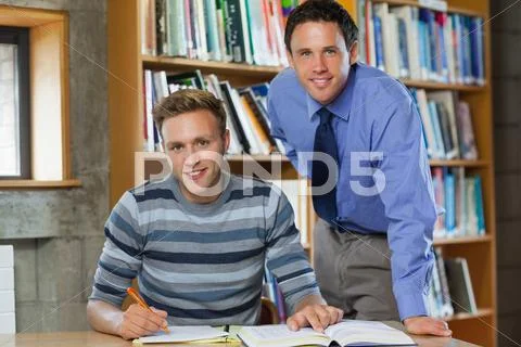 Cheerful lecturer and student looking at camera ~ Hi Res #32699718