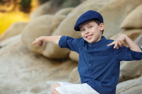 Cheerful little boy having relax outdoors Stock Photos