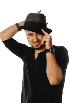 Cheerful macho man in hat looking away and smiling Stock Photos