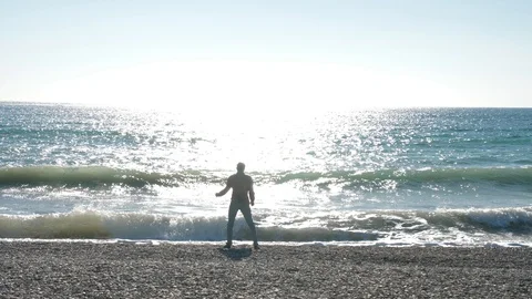 Cheerful man dancing in the sea Stock Footage 97068290