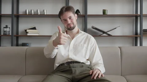 Cheerful Man Showing Thumbs Up During Video Call At Home Office Видео 331793189