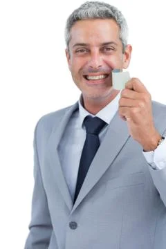 Cheerful man taking away adhesive tape from mouth Stock Photos