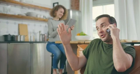Cheerful man talking on smartphone Stock Footage 114117583
