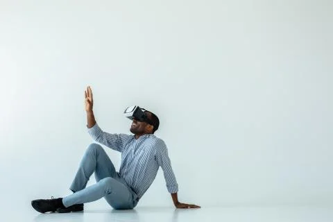 Cheerful man testing VR device Stock Photos