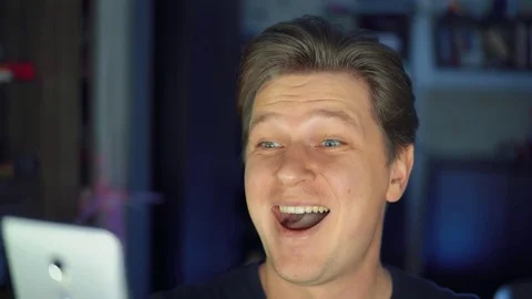 A cheerful man uses a mobile phone. Stock Footage 84564341