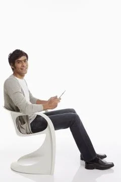 Cheerful man using a digital tablet Stock Photos