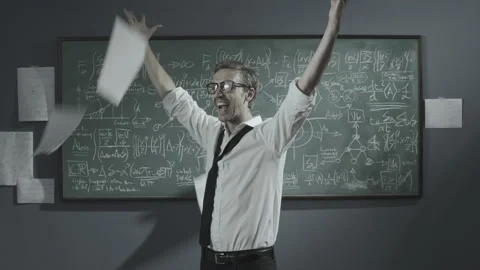 Cheerful mathematician solving a problem and celebrating Stock Footage 139258169