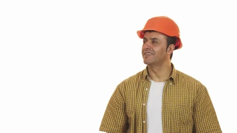 Cheerful mature builser in hardhat posing with a drill machine Stock Footage 85975341
