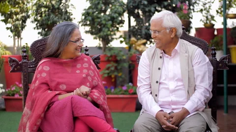 A cheerful middle-aged couple is talking and chatting together - relationship... Stock Footage 242090954