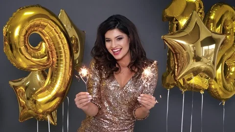 Cheerful model with sparkler at studio shot  Stock-Footage 84063138