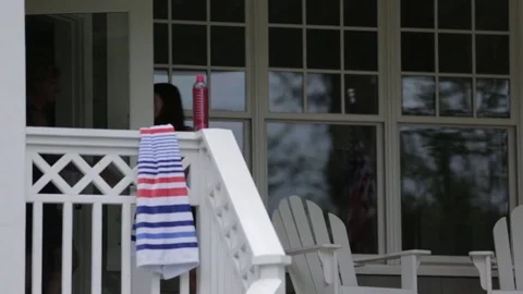 Cheerful mother and daughter leaving house Stock Footage