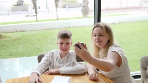 Cheerful Mother and Son Capturing Moments Together Stock Footage 316980302