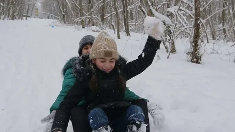 Cheerful mother pulls the sledge with her ecstatic children Stock-Footage 72372791