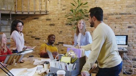 Cheerful Multiethnic Colleagues Cooperating in Designer Office Stock Footage 115443207