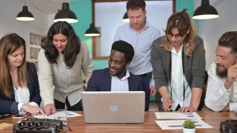 Cheerful multiethnic colleagues working with documents Stock Footage 269346188