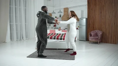 Cheerful multiracial couple during romantic dance Stock Footage 148683239