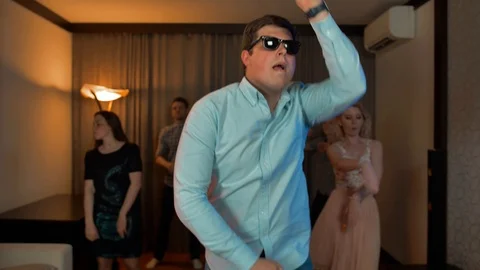 Cheerful nerd guy with glasses dancing and partying. Video stock 96439073