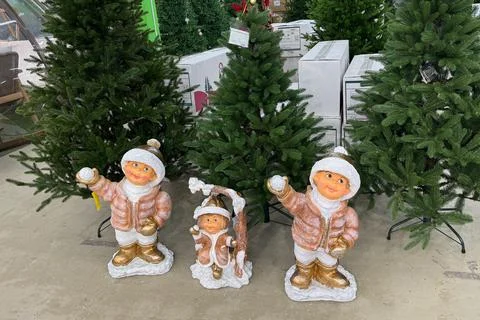 Cheerful nursery snowman figures surrounded by trees and holiday elements 스톡 사진