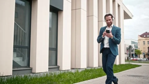 Cheerful office worker having fun outside. Happy male company director fooling Stock Footage 278042776