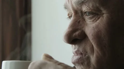 Cheerful old man drinking a cup of coffee Stock-Footage 48058687