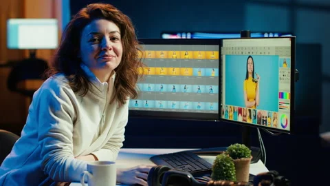 Cheerful photographer using retouching program to edit images Stock Footage 283595754