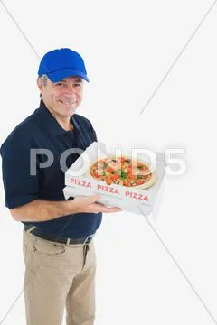 Cheerful pizza delivery man Stock Photos