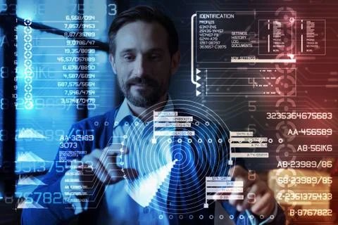 Cheerful programmer looking impressed while working with a new program Stock Photos