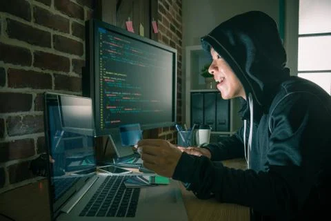 Cheerful programmer man using code language system 库存照片