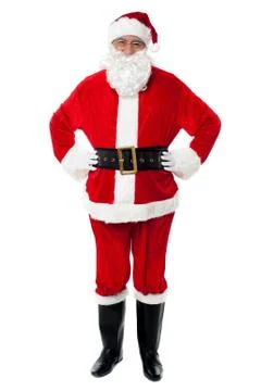 Cheerful Santa Claus posing with hands on waist Stock Photos