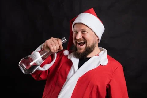 Cheerful Santa with empty bottle studio portrait Stock Photos