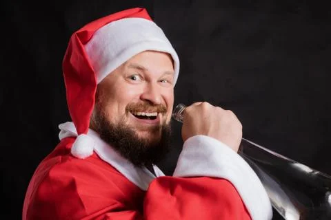 Cheerful Santa with empty bottle studio portrait Foto stock
