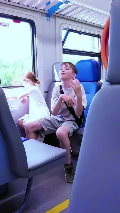 A cheerful school age boy having fun, laughing and gesturing with his hands Stock Footage 338397574