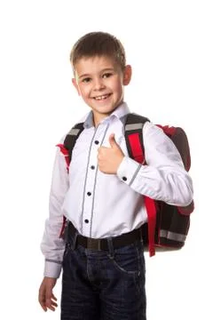 Cheerful school boy with backpack, with thumb up, love going to school on white Stock Photos