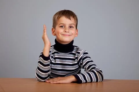 Cheerful schoolboy ready to answer question Stock Photos