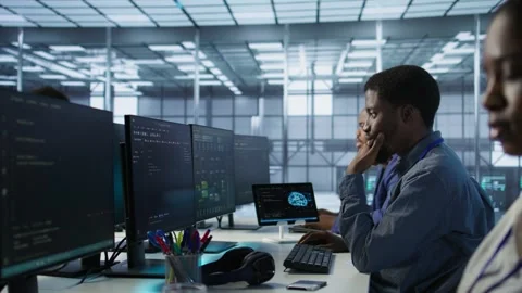 Cheerful server room workers laughing together in office Stock Footage 319573314