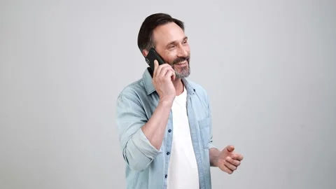 Cheerful sociable friendly man talk telephone prepare business deal Video stock 161952900
