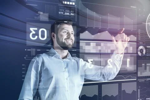 Cheerful software developer smiling and touching a transparent screen Stockfoto's