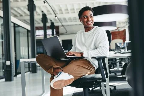 Cheerful software developer smiling in an office Stock Photos