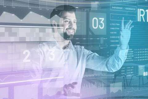Cheerful software developer touching the transparent screen and smiling Stockfoto's