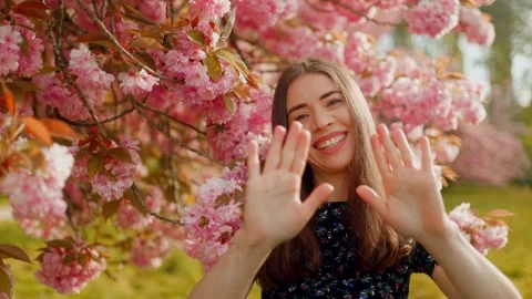 A cheerful springtime portrait full of positive energy, warmth, and natural Stock Footage 307289317