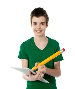 Cheerful student writing notes Stock Photos