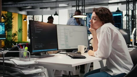 Cheerful technician working in office, using AI specialized hardware Video stock 323332506